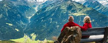 Retired Couple Looking At Mountains